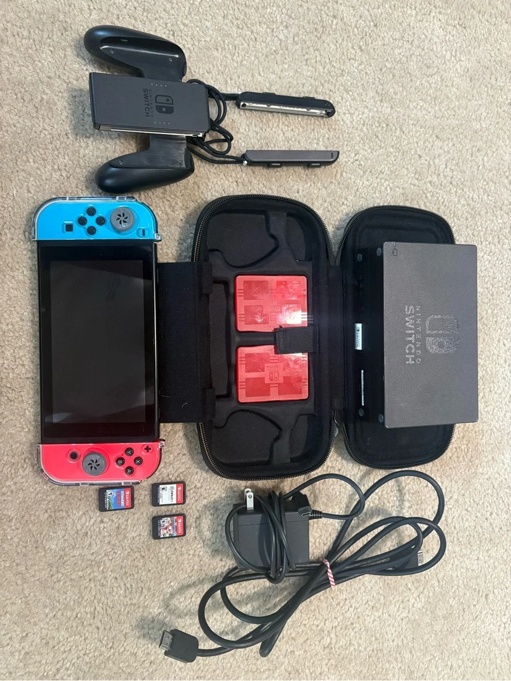 Nintendo Switch with Blue and Red Joy‑Con in Travel Case